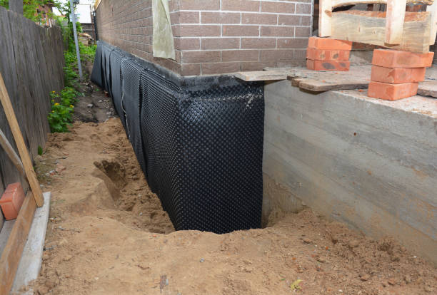 SJ Waterproofing Pros technician performing targeted Basement Waterproofing assessment in Milford, PA